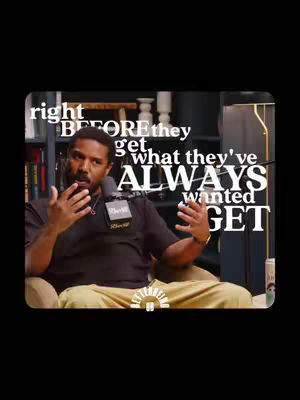 The cover image shows a man in a black shirt and tan pants seated in a chair, gesturing with his hands while speaking into a microphone. He is positioned in front of a blurred background of shelves and a lamp. Overlayed on the image is white text, a motivational quote.
