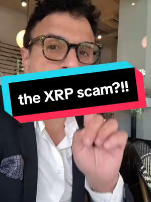 A man with a surprised expression is the subject in the cover image. He's wearing glasses, a blazer, and a white shirt, positioned against a blurred background. A textual overlay in red and black bars, containing the words 'the XRP scam?!?' is positioned prominently across the image.