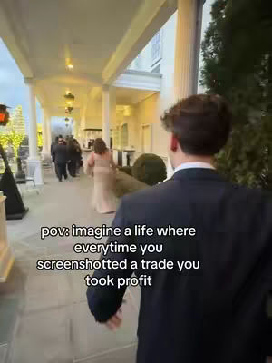 A man in a black suit walks away from the camera in a bright, outdoor setting, likely a covered walkway or veranda, with other people visible in the background. The perspective is from behind the man, with the text overlaying the image.