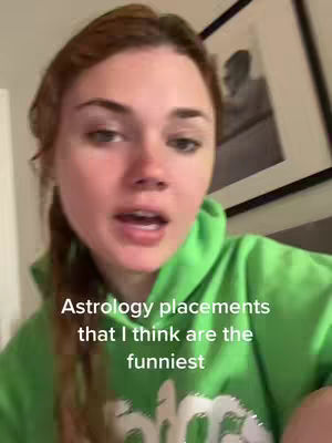 A woman in a green hoodie is looking at the camera, speaking. Text overlayed on the bottom says, "Astrology placements that I think are the funniest". In the background, there is a framed picture.