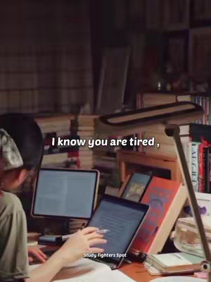 The cover image shows a person, viewed from behind, working on a laptop at a desk filled with books and papers. The person is sitting in front of multiple screens, studying. The scene is illuminated by a desk lamp, creating a warm, focused atmosphere.