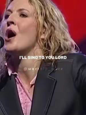 The cover image features a woman in a close-up shot, presumably singing. She has her mouth open, possibly singing into a microphone, indicating a performance or recording. The lighting appears soft and natural.