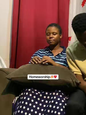A woman in a striped shirt sits on a couch, resting her hands on a pillow, and the bottom half of another person is seen on the right. The cover image has a red curtain in the back.