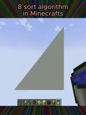The cover image displays a Minecraft scene featuring a gray, triangular structure against a blue sky. The structure resembles a pyramid, constructed block by block within the game. The top of the image has text overlayed and shows the name of the video