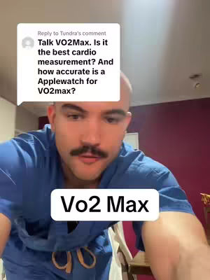 The video features a close-up of a man, his face filling the frame. He has a well-groomed mustache and a bald head. Overlayed on the bottom is a white box with the text 'Vo2 Max' in bold black font. Above the man's head, a comment box appears with text related to Vo2 Max and asking about Apple Watch accuracy.