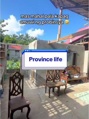 An outdoor scene featuring a courtyard with concrete walls and chairs arranged on a concrete floor. Text overlay is displayed.