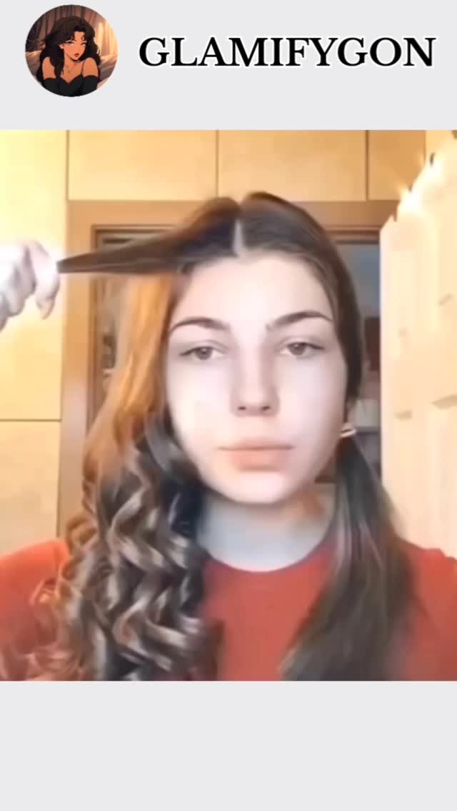 The cover image displays a young woman in front of a neutral background. She appears to be demonstrating a hair styling technique. Her hair is parted on the side and has some curls. The video seems to be a tutorial or a hair care tip.