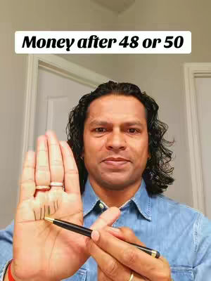 The cover image features a man with dark hair in a light blue shirt, holding up his open palm, with lines drawn on it in black. A pen is held in his other hand, pointing towards the drawn lines. Above him, text overlay states, "Money after 48 or 50".