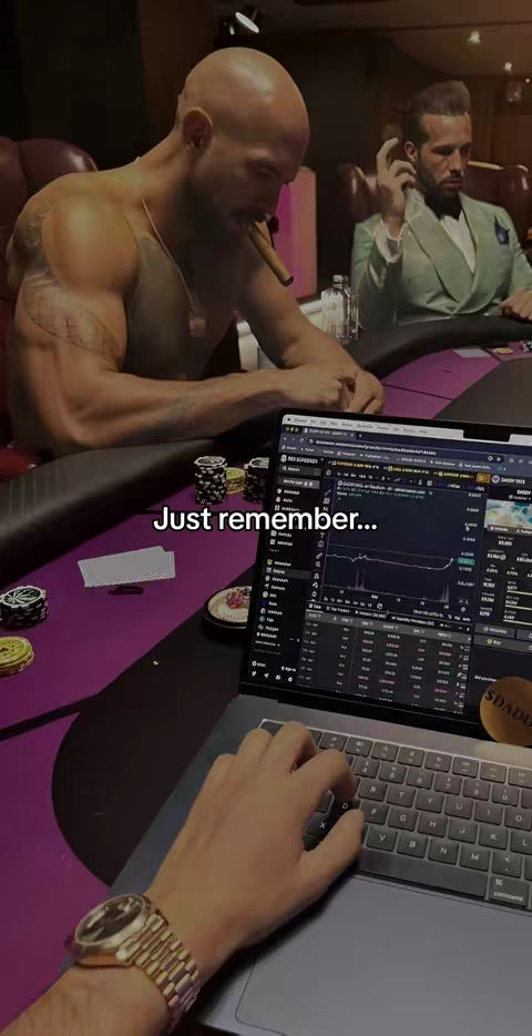 The image shows three men at a poker table. One man, shirtless with tattoos, is smoking a cigar and looking down. Another man is in a suit, and the hand of a third person is visible, typing on a laptop displaying a financial chart. Overlay text reading 'Just remember...' is present.