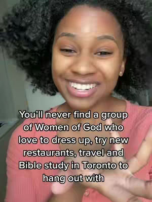 A young woman with natural hair smiles looking at the camera. Text overlayed on reads, 'You'll never find a group of Women of God who love to dress up, try new restaurants, travel and Bible study in Toronto to hang out with'.