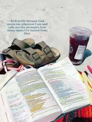 The cover image showcases a collection of items, including a bible, a pair of sandals, and a drink, arranged on a sandy surface. The sandals, in neutral tones, sit near an open bible with highlighted passages. A clear cup with a red beverage is also present. The background is light and suggests an outdoor setting.