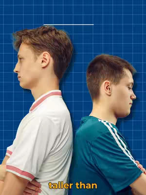 The image features two young men standing back-to-back against a blue grid background. A white line indicates a comparison of their heights. The words "taller than" appears in yellow overlaid at the bottom of the image.