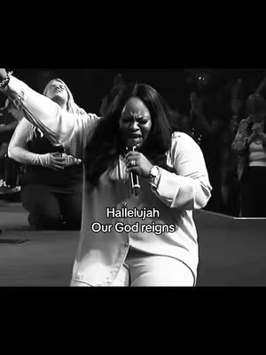 A black and white cover image depicts a woman with dark hair, holding a microphone and singing passionately. Her arm is raised, and she is on stage, possibly in a church, with another person slightly behind her. Text overlays the image.