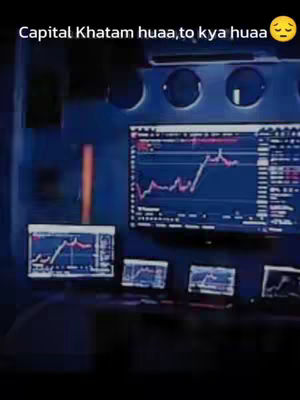 The image shows a dark interior with multiple computer screens displaying financial charts. Text overlays the image. The composition is dark and focused on the screens. A sad emoji is present with the text.