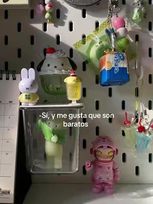 The cover image shows a vertical shot with a collection of cute toys and accessories on a white pegboard. The composition is colorful and playful.