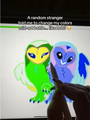 The image shows a digital art scene with two stylized owl-like characters on a bright background. Text overlaid at the top reads, 'A random stranger told me to change my colors mid-art battle… like huh?'. The bottom of the frame shows a hand with a stylus in it, adding to the art.