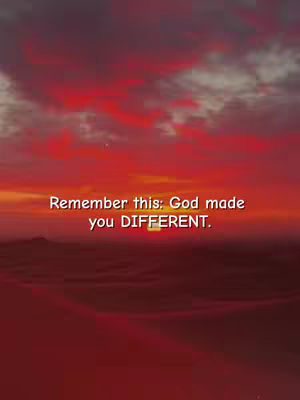 A vertical image featuring a vibrant sunset with a gradient of red, orange, and yellow hues. The sky is filled with textured clouds, and the text overlayed at the center: 'Remember this: God made you DIFFERENT.'