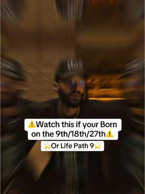 The cover image features a slightly blurry, vertical shot of a man with a beard, wearing glasses and a cap, in what appears to be an indoor setting. The man is centered and has his arms slightly outstretched. Overlayed on the image is a rectangular white text box with black text that reads, "Watch this if your Born on the 9th/18th/27th! Or Life Path 9", along with relevant symbols.