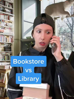 A woman with a surprised expression is on the phone, standing in a bookstore setting. The cover image has two boxes of texts. Above the woman, books are on the shelves.