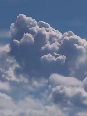 An image of a blue sky filled with large, puffy white clouds. The clouds are clustered together, creating a dynamic visual texture. The lighting suggests a bright, sunny day.