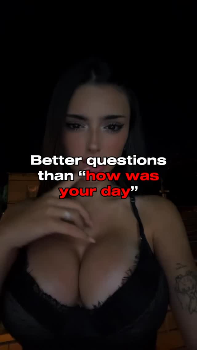 A young woman with long dark hair is the focus, with a slightly blurred, dark background. She has a fair complexion, dark eye makeup, including long eyelashes, and full lips. She is wearing a black top that has lace detailing trimming the top. The text overlay is white with a red accent, centrally positioned above the woman's face.