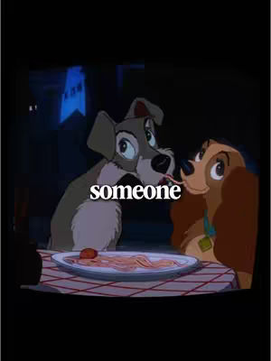 A cartoon image from 'Lady and the Tramp' shows two dogs, a grey dog and a tan dog, connecting over a strand of spaghetti. The dogs are at a table with a red and white checkered tablecloth, in a softly lit, dark setting. The text layer reads 'someone'.