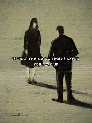 An artistic image featuring two silhouetted figures, a man and a woman, standing in what appears to be a plain, neutral-toned environment, perhaps outdoors. The woman faces away from the viewer, her form defined by a long, dark dress. The man is seen from the back, wearing a dark jacket. A quote overlayed in the center reads, 'IS THAT THE MAGIC BEGINS AFTER YOU GIVE UP'. The image has a melancholic or contemplative tone, suggested by the shadows and the solitary figures.