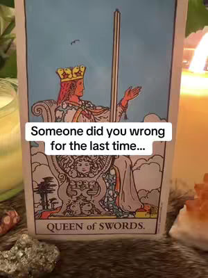A tarot card, "Queen of Swords," is prominently displayed with a text overlay. The card shows a woman in a crown, seated on a throne. The background has a candle and crystals.