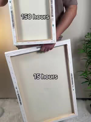 A person holds two blank canvas frames, one on top of the other. The top one is held in front and has the text overlayed that says "150 hours" and the one under it shows "15 hours".
