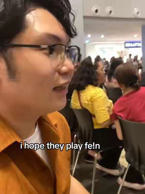 A selfie-style shot with the creator looking to the left of the frame, a crowd is faintly visible behind him, the text overlay reads, 'i hope they play fe!n'