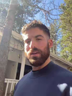 The cover image features a man looking towards the camera. He has a beard. The background includes trees and a white house.