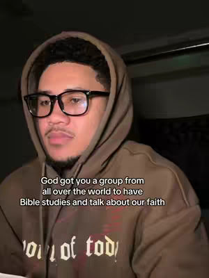 The cover image features a young man in a brown hoodie looking downwards. He wears glasses, and text is overlaid on the image.