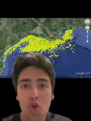 The cover image shows a man in the foreground and a map of the Gulf of Mexico in the background. The map, taken from Google Earth, displays an area marked with numerous yellow dots, possibly indicating the location of abandoned oil rigs. The man, positioned in front of the map, appears to be speaking or gesturing towards the information. The color scheme is dominated by blues, greens, and yellows, with a black background framing the scene, and the man has a short haircut and neutral expression.