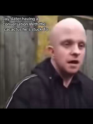 A man with a shaved head is looking at the viewer with an open mouth, ready to speak. Text is overlaid on the top of the image.