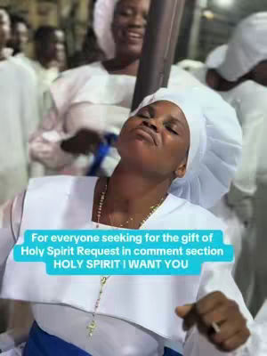A woman in a white head covering and attire is the central figure, with other individuals partially visible in the blurry background. The image has a soft, slightly desaturated color palette, with focus on the woman's face, which is positioned upwards as if in a moment of spiritual contemplation. A text overlay in a blue rectangle gives context for the video.