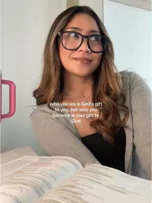 The cover image features a woman wearing glasses, looking slightly upward with a soft smile, suggesting contemplation. She's sitting with a book open in front of her. Text on the image provides a quote. The background is neutral, with soft lighting.