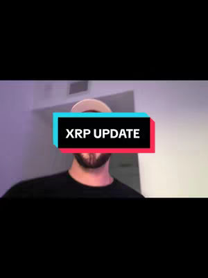 A man is centered in the shot, his head and upper body visible against a blurry background. He is wearing a dark shirt and a cap. A rectangular text overlay reading "XRP UPDATE" in white text, is placed over his upper chest. The overlay has a cyan top area and a red bottom area.