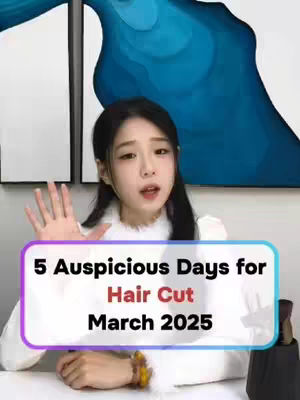 A woman is centered in the frame, positioned in front of a blurred blue and white abstract background. She is making a hand gesture with her right hand and looking up. A rectangular text overlay at the bottom of the screen displaying "5 Auspicious Days for Hair Cut March 2025".