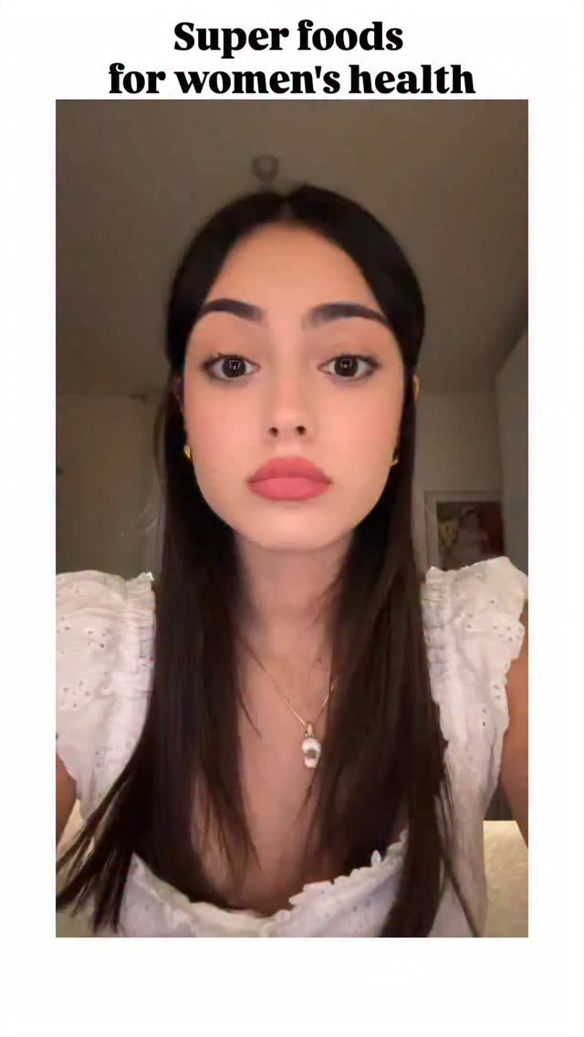 A woman with long, dark hair and a white top is centered in the frame. Text at the top reads "Super foods for women's health."