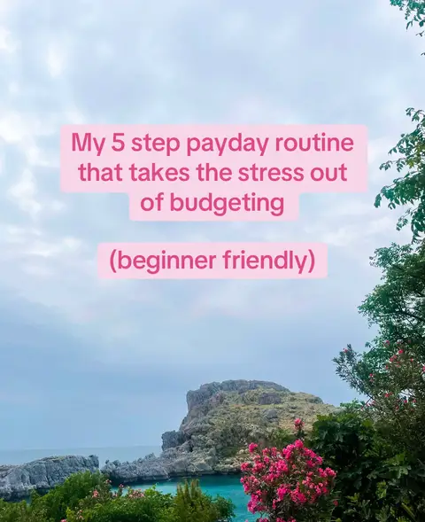 A scenic cover image with a light blue sky, a body of water, and a rocky landscape. The foreground features green foliage and pink flowering plants. A rectangular text overlay in light pink states the video's topic.