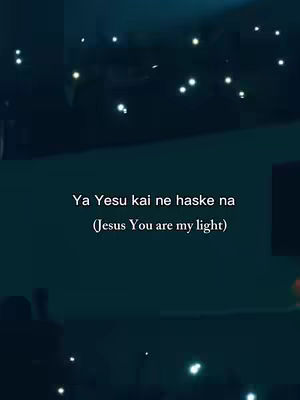 Dark, blurry image with bright, indistinct lights scattered across the background. Text overlayed in the center reads in white font.