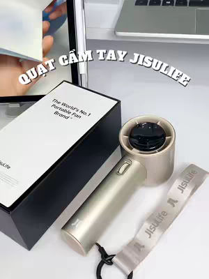 The cover image shows an unboxing of a Jisulife portable fan on a white surface. In the center is a box with "The World's No. 1 Portable Fan Brand" printed on it. To the right, there's a fan with a handle and a black top. A ribbon with "Jisulife" is seen. In the background, there is a laptop and a computer screen.