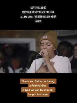 The cover image features a vertical composition. At the top, against a black background, there's white text. Below, a woman in a brown beanie is singing into a microphone. Her face is focused, and she has a bracelet and ring visible. Inset at the bottom is another rectangular text box.