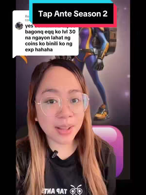 A woman is centered, framed from the chest up, with her face in focus. She has long brown hair and wears glasses. To her left, a comment overlay is visible. Behind her, a game character in a superhero-like outfit strikes a pose.