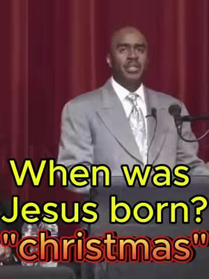 A medium shot features a man in a gray suit standing behind a podium. The background is a solid red curtain. Overlaying the image are the words "When was Jesus born?" in yellow with a black outline, followed by the word "christmas" in a red, stylized font.