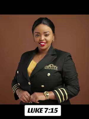 A centered shot of a woman in front of a brown background, she is wearing a black blazer over a yellow top and has a wristwatch on, the text at the bottom says "LUKE 7:15".