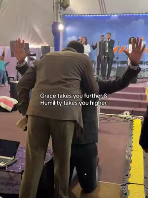 The cover image shows a religious service in progress. Two men are embracing while other people are in the background. A stage with a screen and some speakers can also be seen.