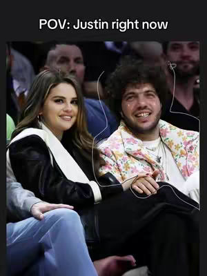 The cover image shows Benny Blanco and Selena Gomez sitting close together at what seems to be an event. A text overlay reads 'POV: Justin right now'.