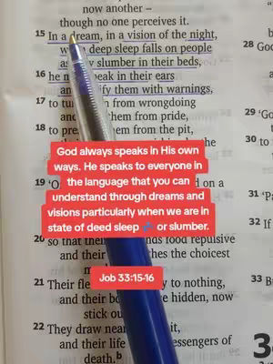 A close-up shot of an open book with text highlighted by a pen. Overlaid are red rectangular blocks with white text. A blue pen is placed diagonally across the open book page.