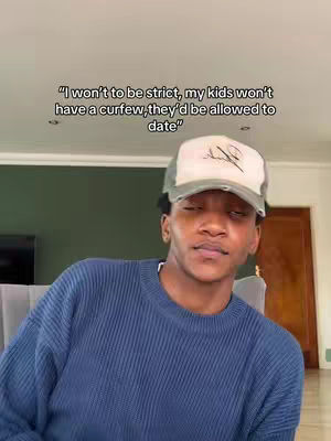 A young man wearing a blue sweater and a baseball cap is looking at the camera in a room with a neutral background. Text overlayed on the image says, "I won't to be strict, my kids won't have a curfew, they'd be allowed to date".